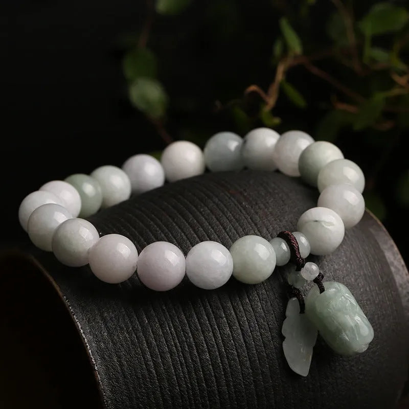 Natural emerald green jade bracelet with silver-plated hanging charms including Maitreya Buddha