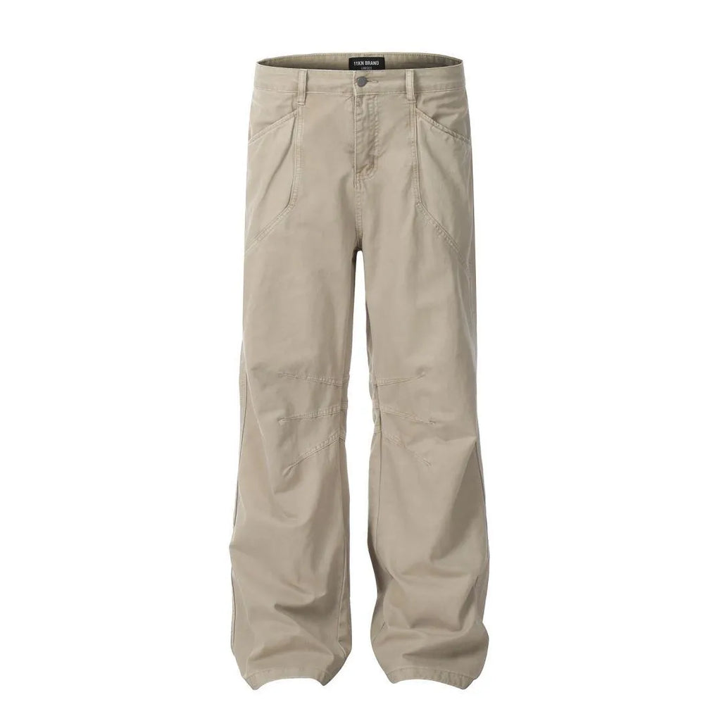 Men's brown loose-fit high-waisted straight-leg cotton trousers on a hanger.
