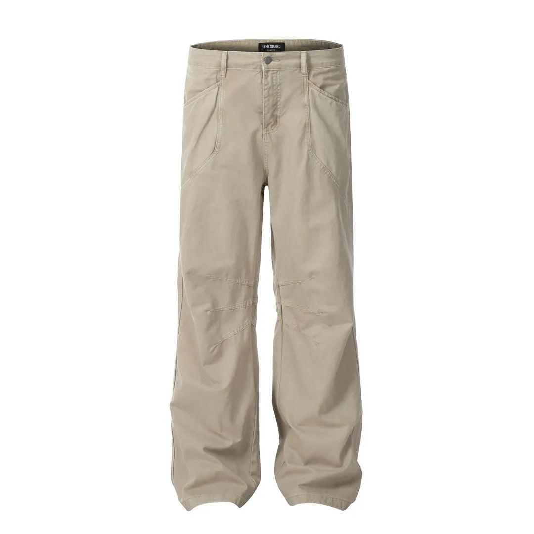 Men's brown loose-fit high-waisted straight-leg cotton trousers on a hanger.