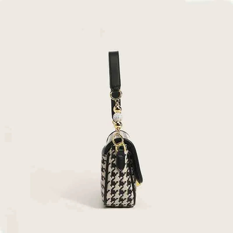 Houndstooth plaid shoulder bag with embossed texture, 23 x 7 x 14 cm, showing slit pocket and picture colour.