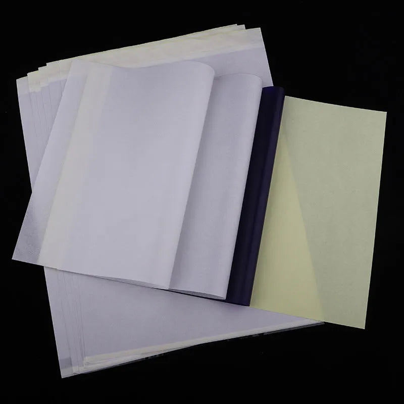 A4 tattoo transfer paper sheets with clear guide lines and a tube of transfer paste gel.