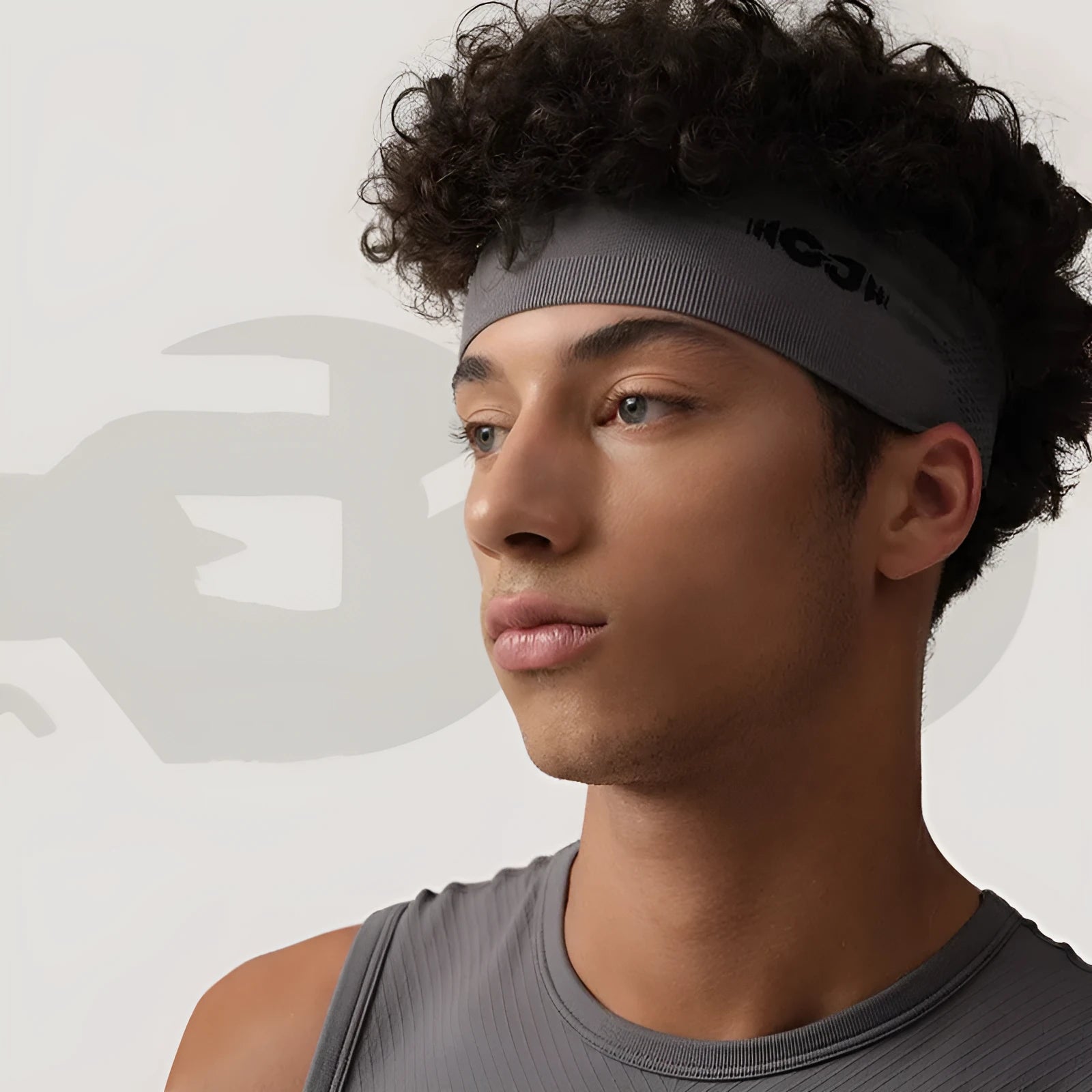 Seamless knitted sports hair band for men and women in black, grey, and blue.