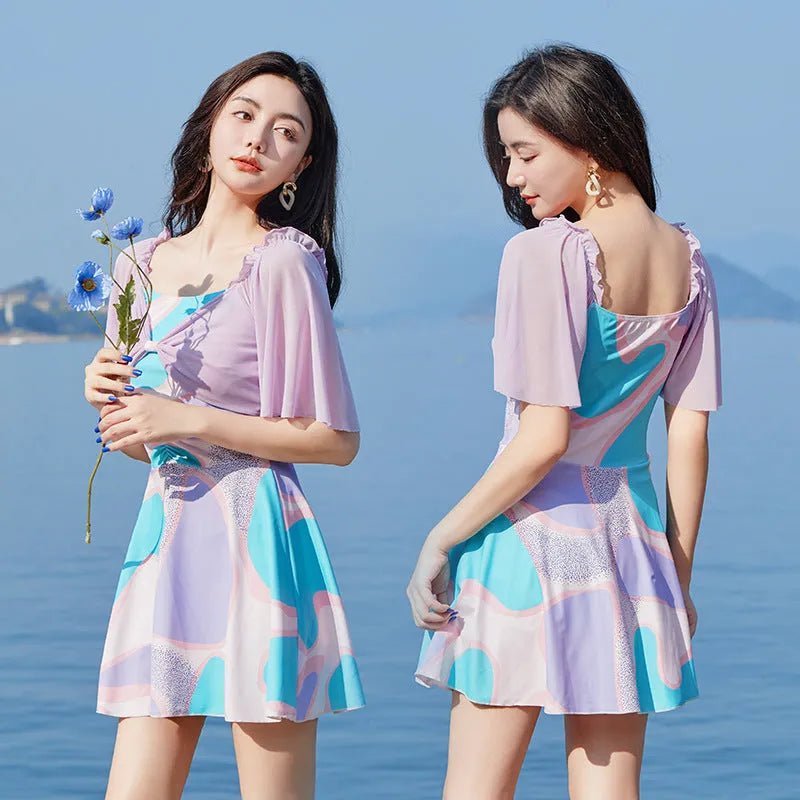 Women's high-waisted one-piece swimsuit with floral pattern in light purple or light blue colour