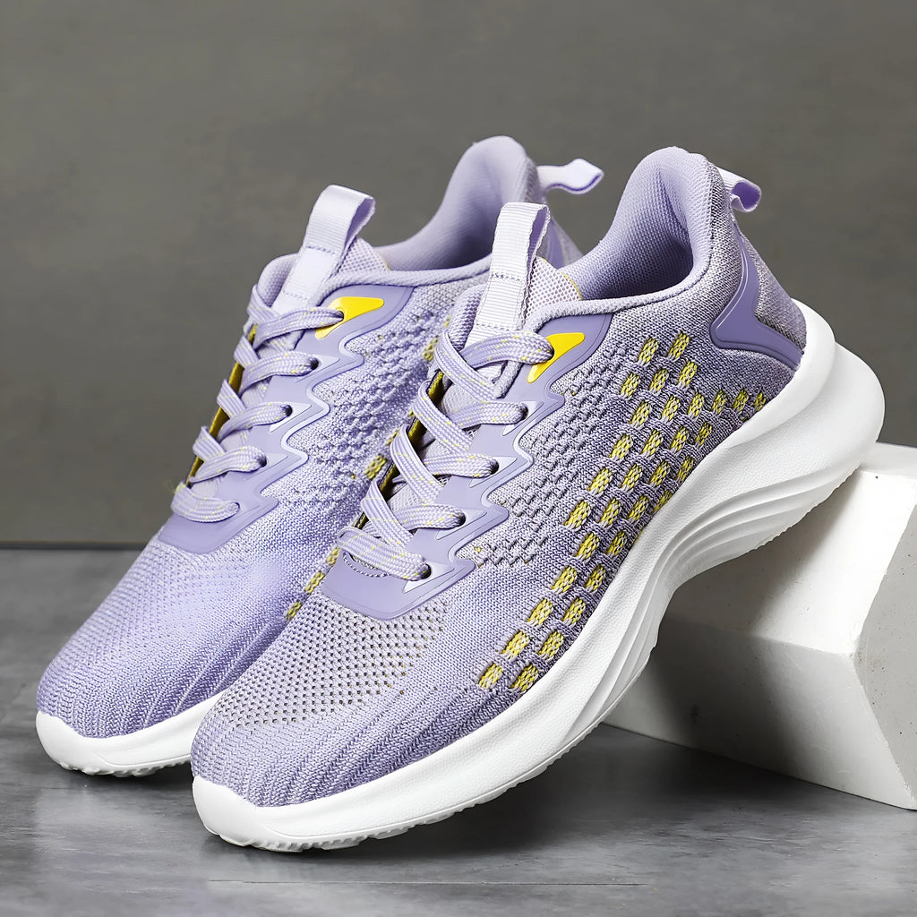 Women's Lavender Purple Flyknit running shoes with mesh detailing and a striped pattern on a white background.