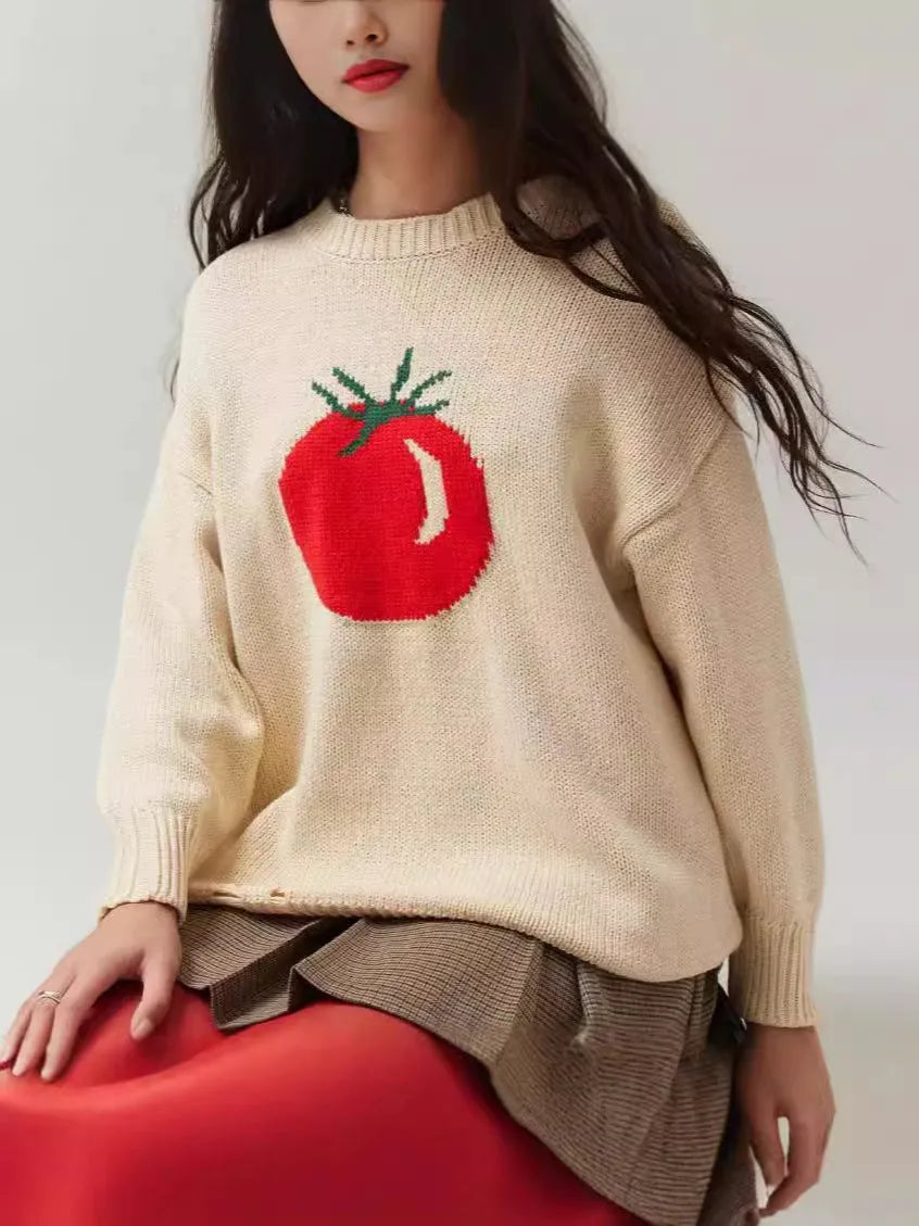 Women's milky white acrylic jacquard pullover sweater with round neck and long sleeves laid flat.