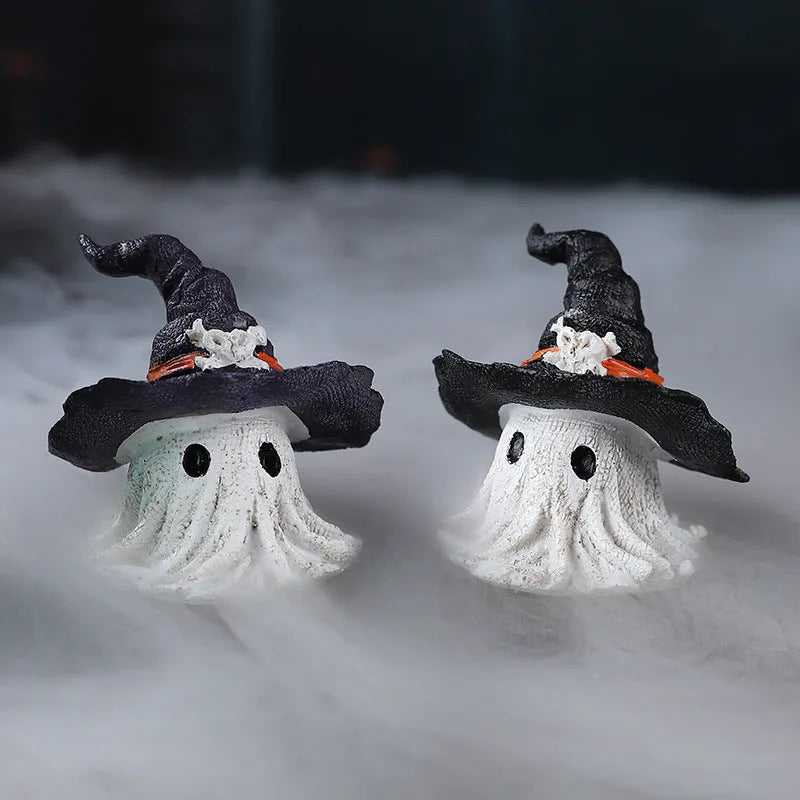 Purple and black resin wizard hat and ghost holiday ornaments.