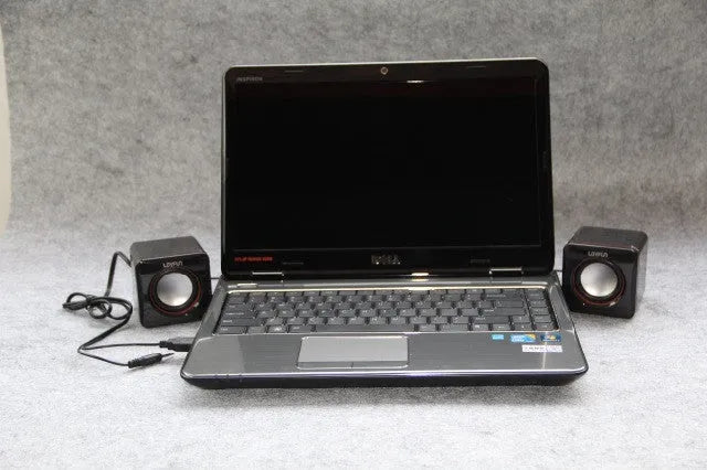 Small square black USB-powered 2.0 computer speaker for PC desktop.
