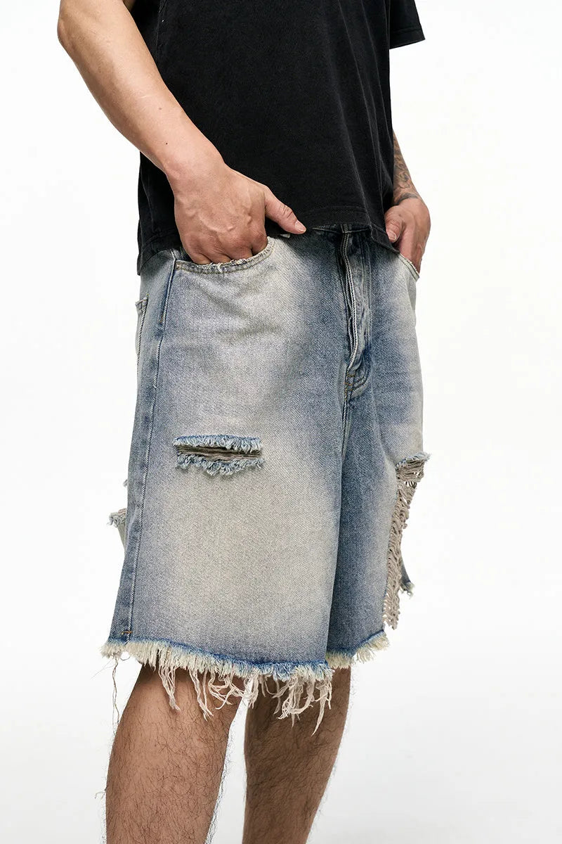 Light blue retro washed men's baggy denim shorts on a mid-rise mannequin, showing wide-leg cut.