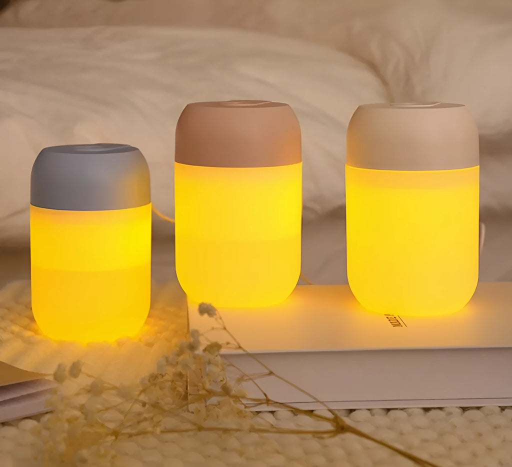 Small white cylindrical USB humidifier for desktop aromatherapy and humidification.