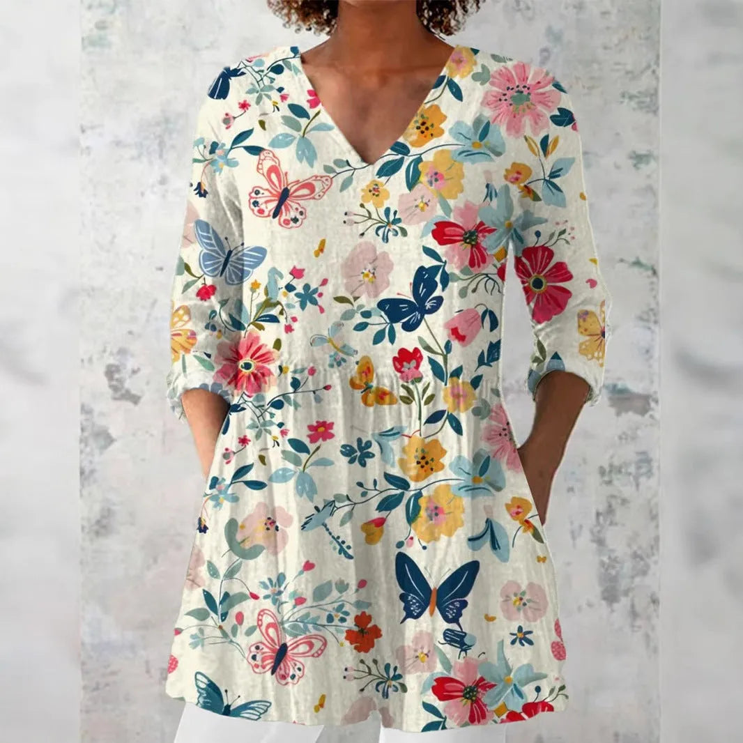 Women's retro-style slim-fit long-sleeved top with a colourful digital print pattern, shown on a model.