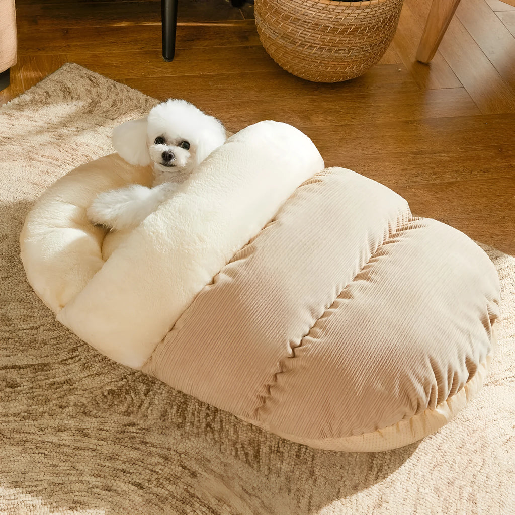 Slipper-shaped cat cave bed with corduroy exterior and self-warming design on hard flooring