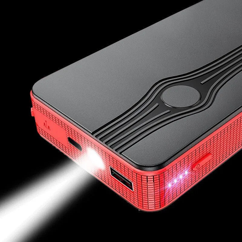 Red K4-E automotive emergency jump starter and power bank unit with charging cable.