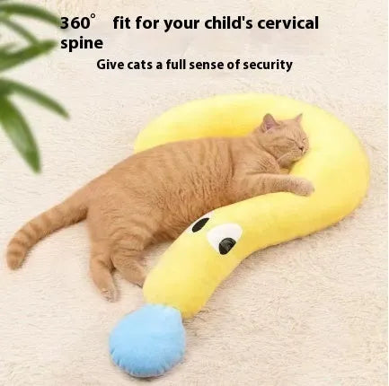 Blue U-shaped question mark cat pillow on a carpet, showing its contoured neck support design.