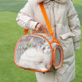 Transparent hard-shell cat backpack in grass green colour with shoulder straps, showing interior space dimensions