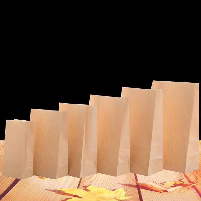 Yellow kraft paper tin foil bag with inner aluminium layer for snack food packaging.