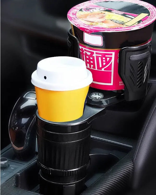 Black carbon fibre car cup holder with a retractable base on a car centre console.