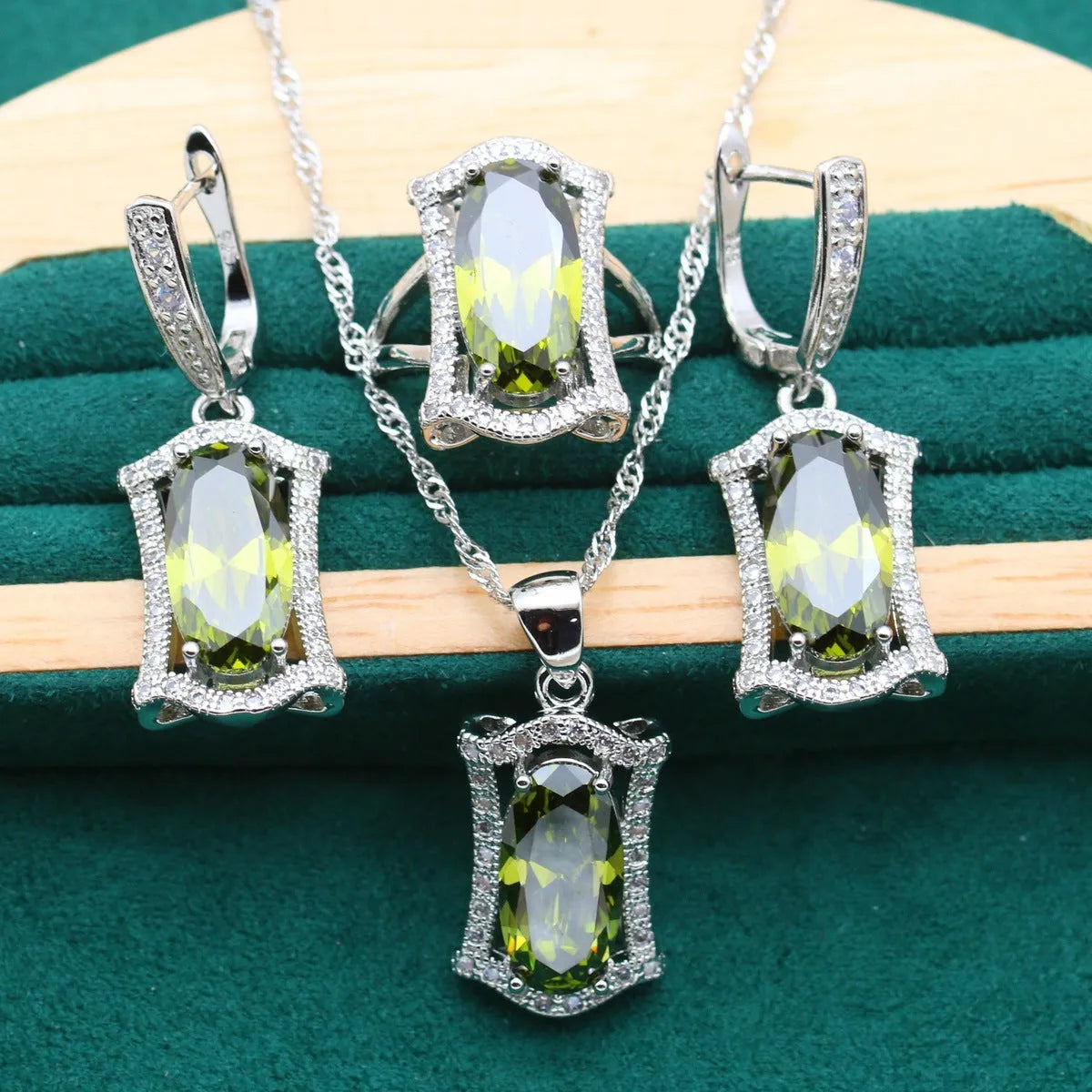 Anti-allergy alloy zircon jewellery set showing necklace, earrings, ring and bracelet in yellow or olive colours