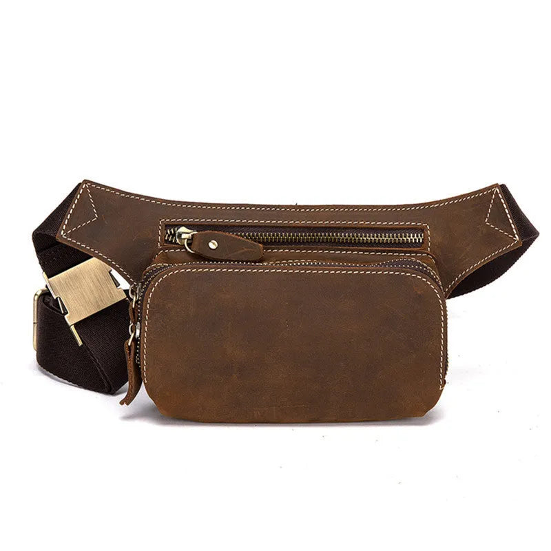 Brown cowhide leather men's waist bag showing pull-closure, worn on hip, with internal phone pouch visible.