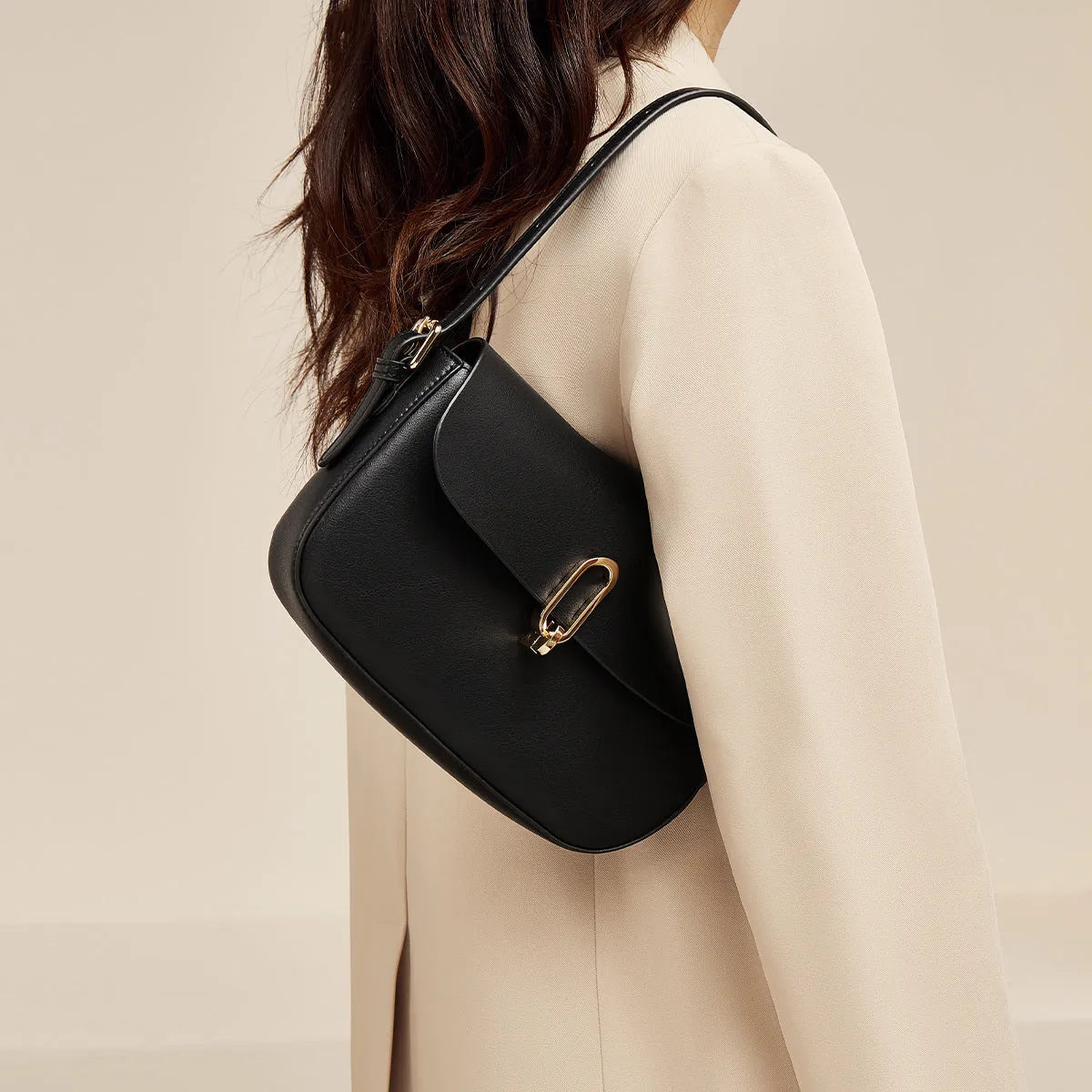 Black genuine leather square messenger bag with lock closure and shoulder strap