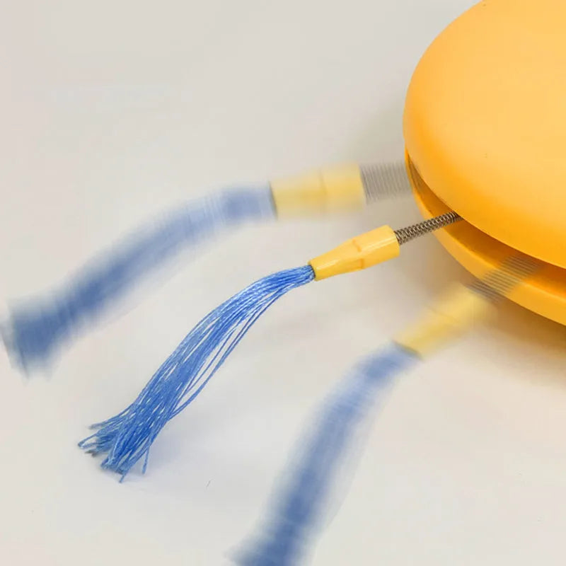 Blue rechargeable robot cat toy with laser pointer and feather attachments on grey floor