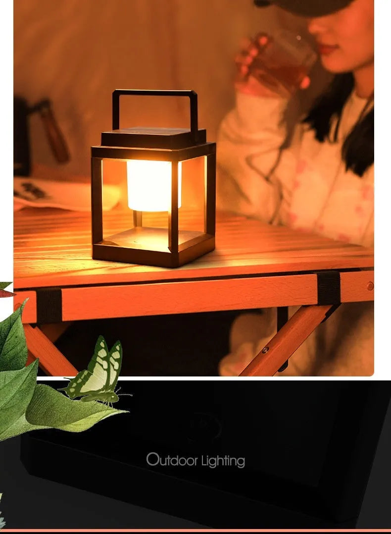 Outdoor USB handheld multifunctional charging ambient light lantern with black cover and white shell