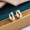 Geometric copper drop earrings with zircon treatment in 14K yellow gold colour