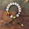 White jade Bodhi bracelet with lotus and pumpkin beads on open rope with ring clasp