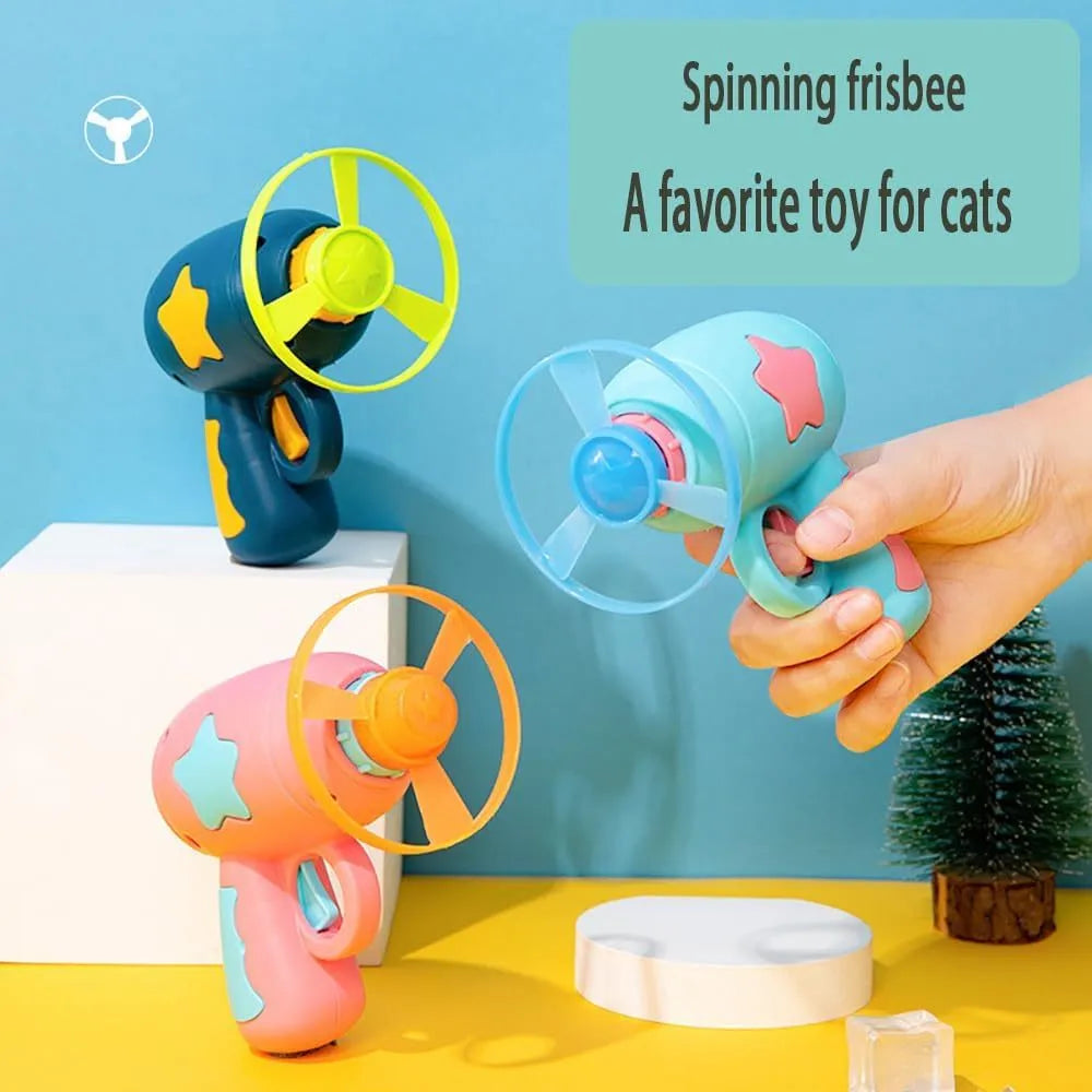 Blue plastic cat toy gun with spinning disc launcher for indoor feline entertainment