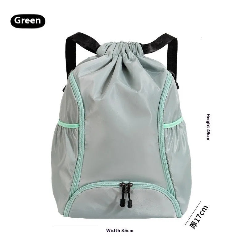 Large black cube-shaped sports backpack with a drawstring top closure, shown on a neutral background.