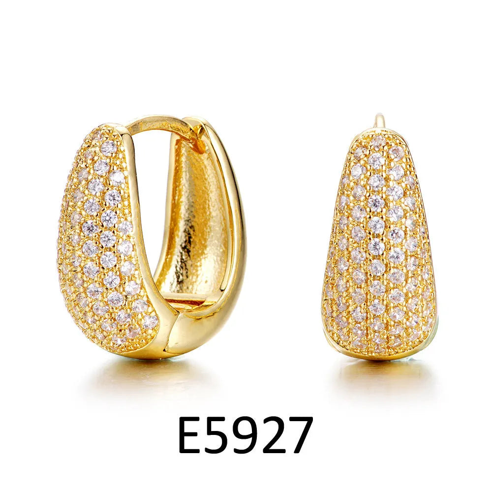 Brass gold plated heart-shaped ear clip earrings with zircon and gang drill details