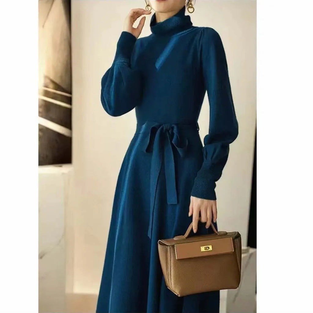 Rose red loose turtleneck knit dress with long sleeves and an elastic waist.