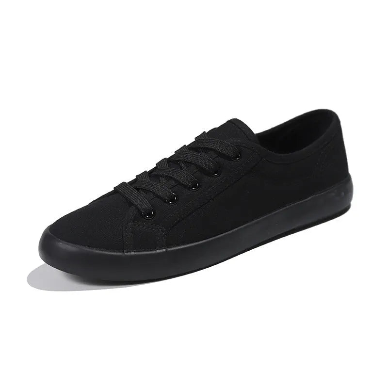 All-black women's canvas lace-up work shoes with flat rubber soles