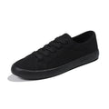 All-black women's canvas lace-up work shoes with flat rubber soles