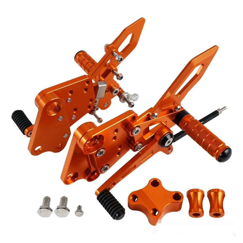 Black and orange KTM DUKE motorcycle footpeg bracket assembly for 125 200 250 390 models