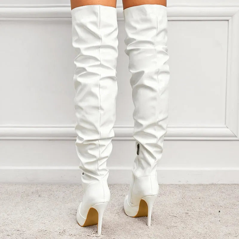 Women's knee high super high heel boots with side zipper, pointy toe, and leather stitching detail in solid colour