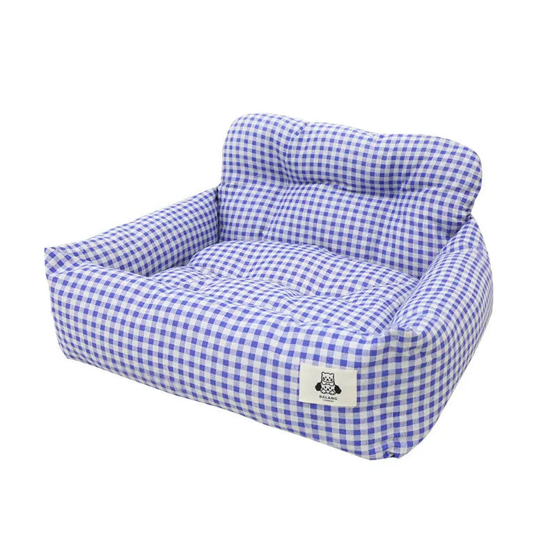 Grey and blue plaid cloth car-mounted dog travel nest shown in two size options.