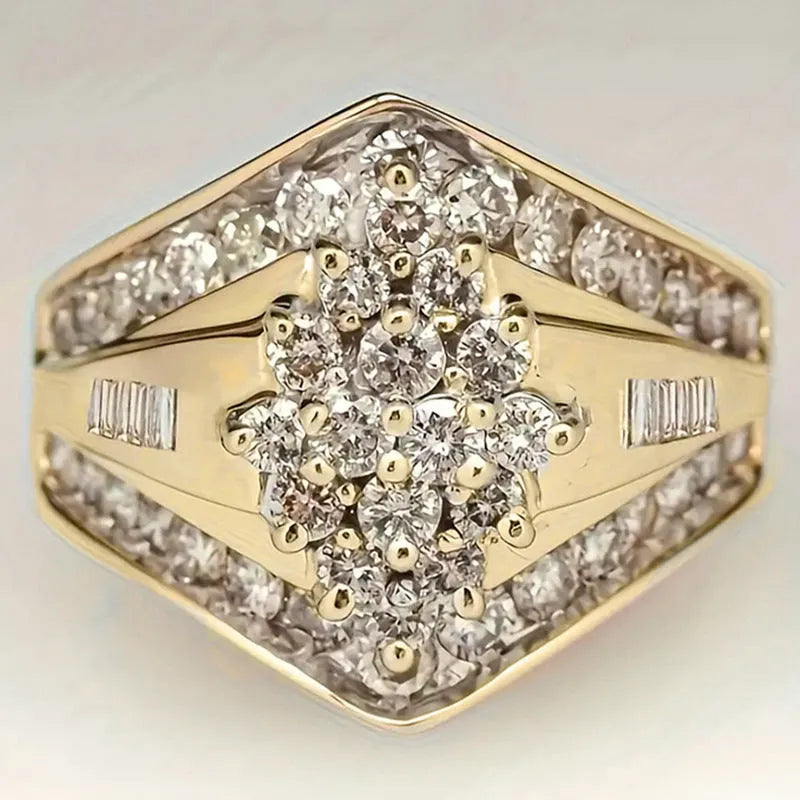 Geometric gold-coloured copper palace style ring on a plain background.