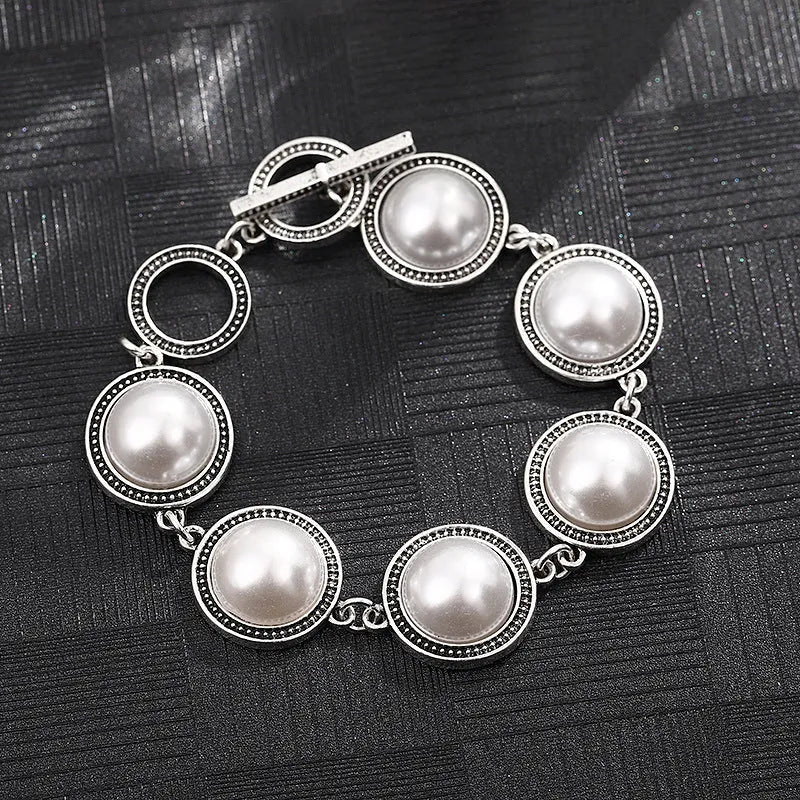 Ethnic style turquoise bracelet with ancient silver finish on wrist, green colour option