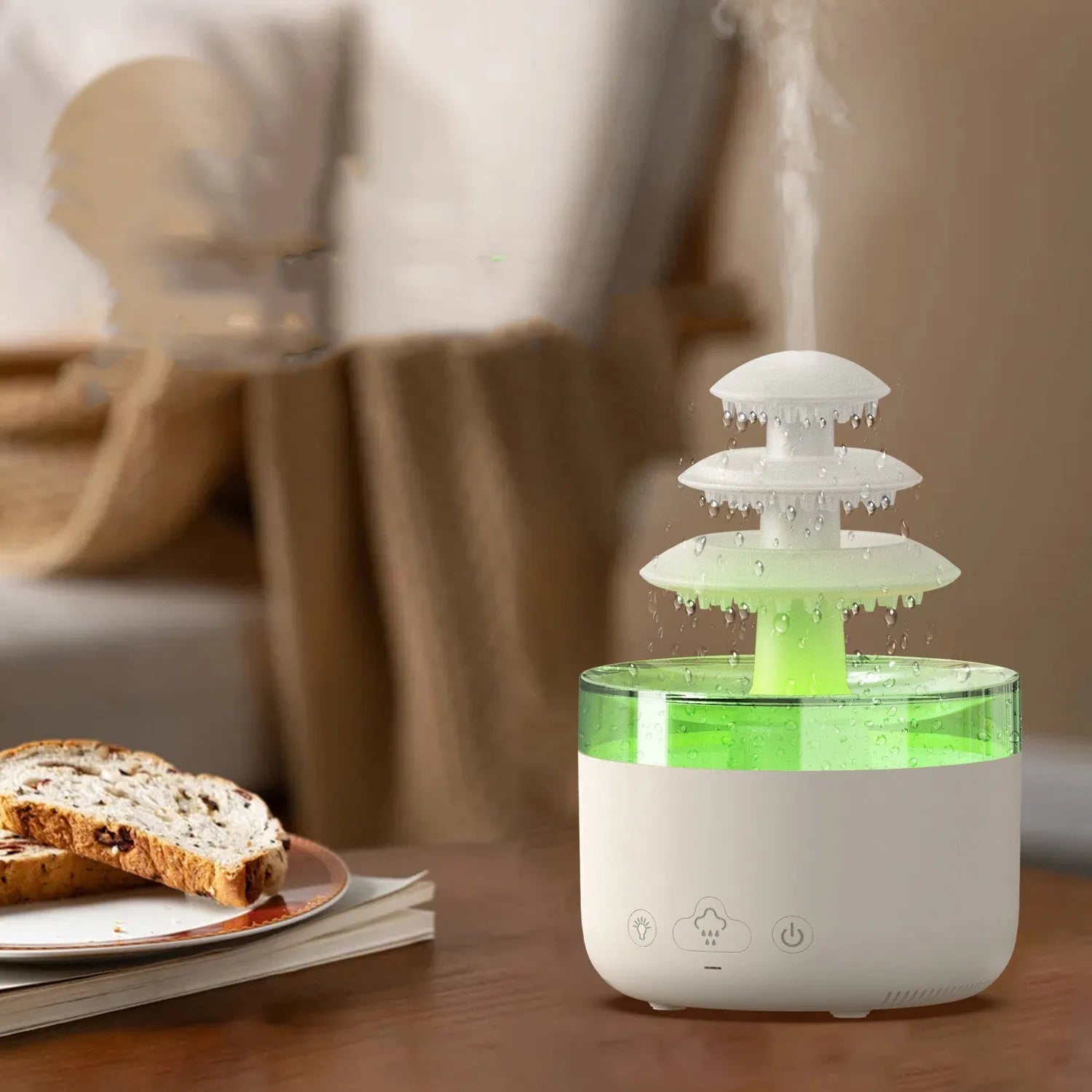 White Cloud Rain air humidifier and essential oil diffuser with colourful LED lights on a wooden table.