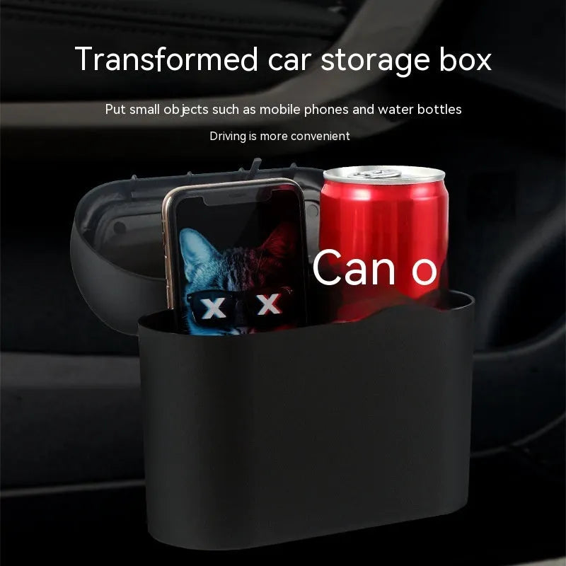 Black plastic folding car trash can placed between vehicle seats.