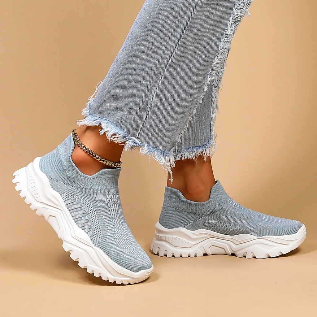 Light blue women's mesh slip-on sports shoes with woven design and round toe