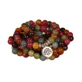 108 bead multi-strand bracelet with natural tourmaline stones and alloy clasp on a wrist.
