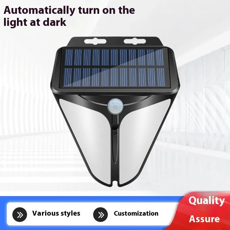 Heart shaped human induction solar wall lamp with binocular lights on an exterior wall in a villa courtyard