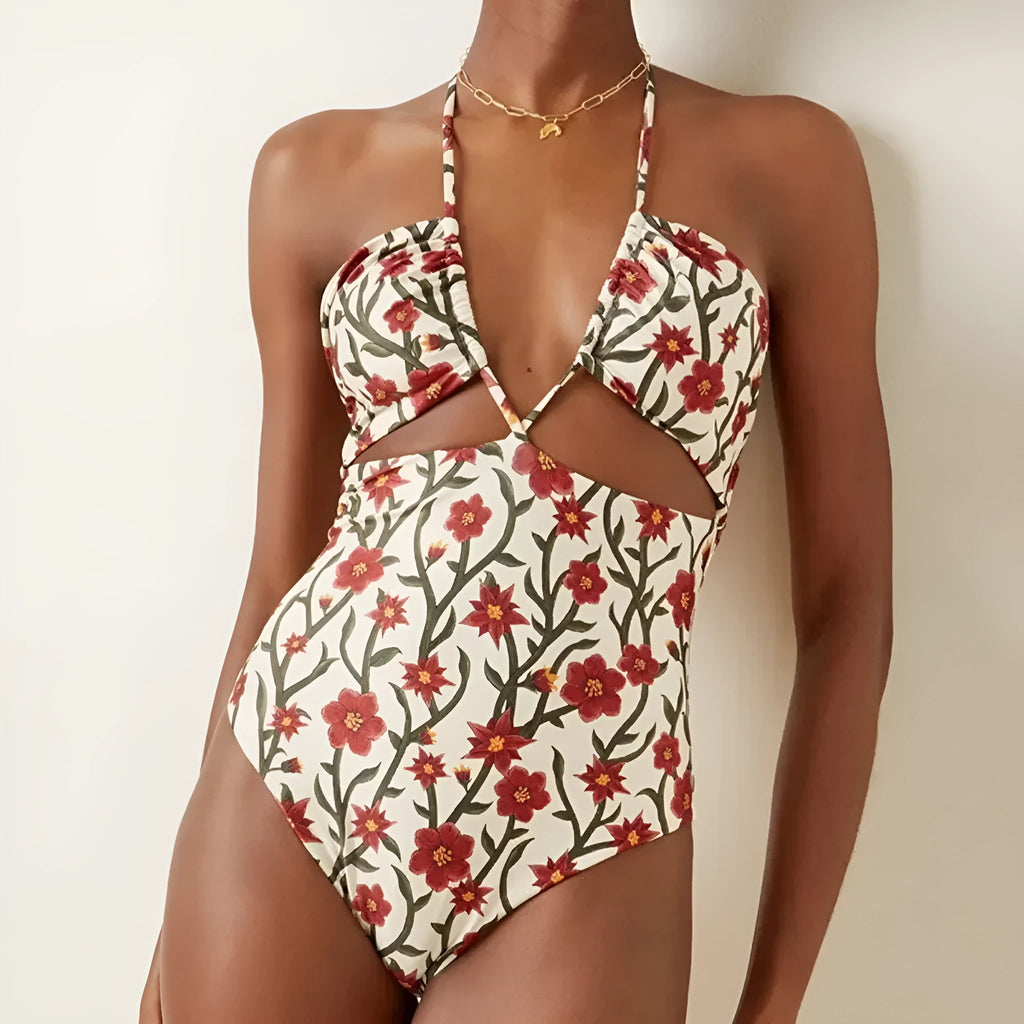 Women's two-piece swimsuit set with halter neck design and floral pattern gauze skirt