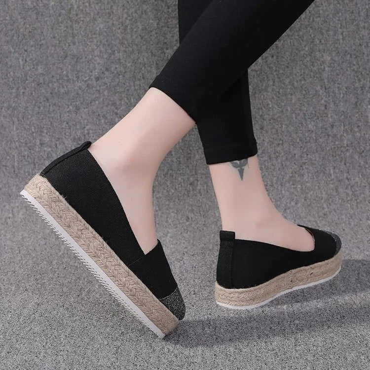 Plus size breathable canvas flat shoes in black and beige with round toe and slip-on design.