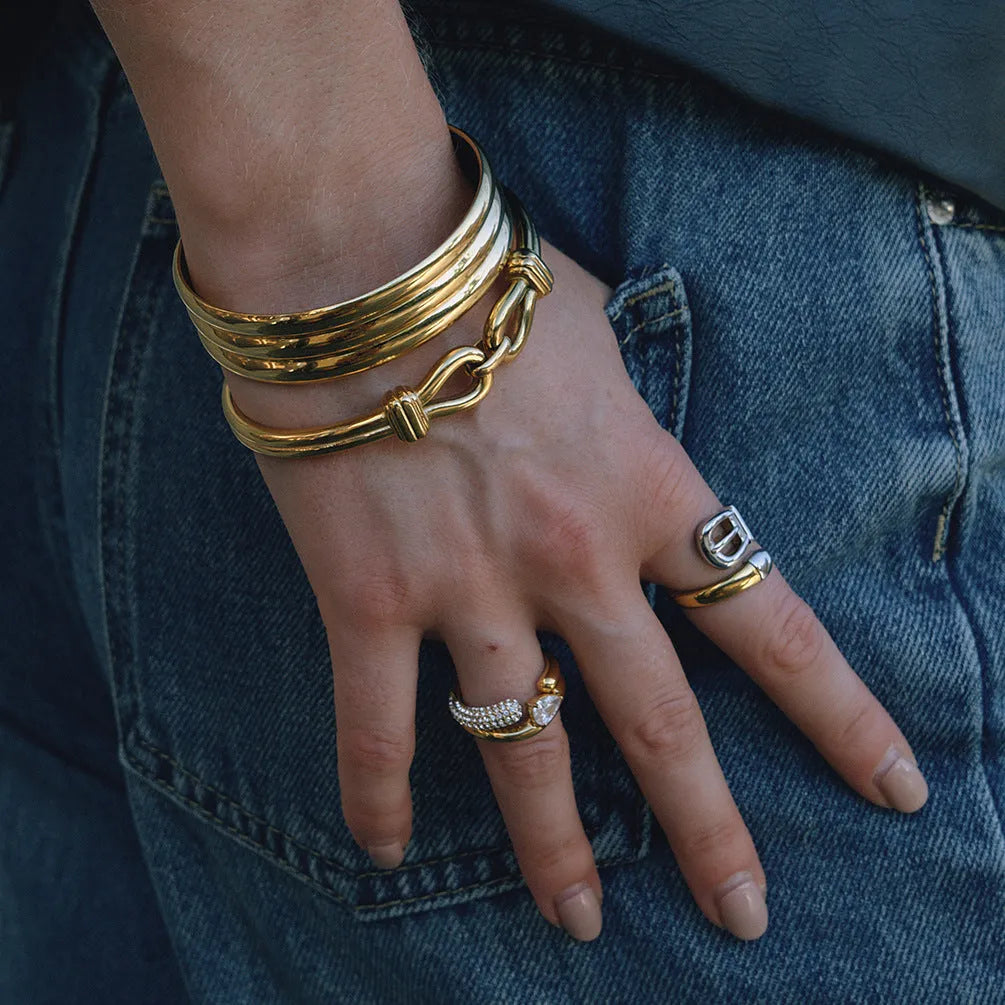 Light luxury stainless steel bracelet with buckle, electroplated finish, connection design, on white background