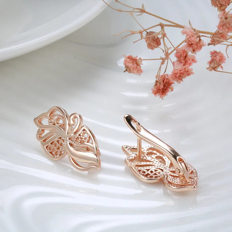 Rose gold geometric earrings for women with hollow carved copper design and rhinestone accents, one pair