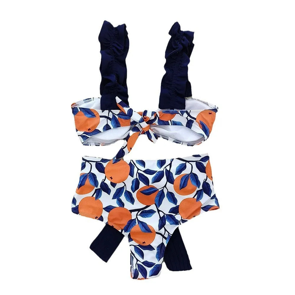 Blue and orange leaf print women's high waist bikini swimsuit on a mannequin.