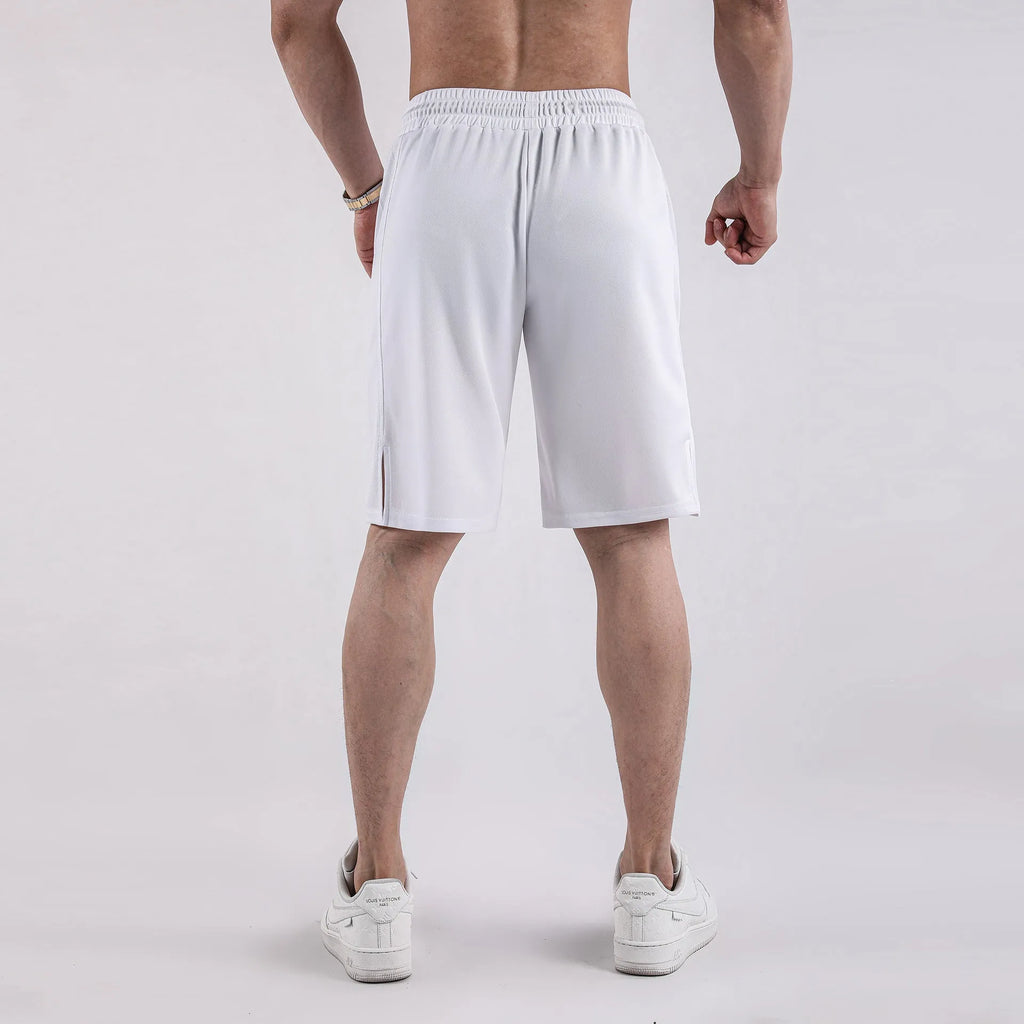 Men's black quick-dry mesh shorts with elastic waistband on a neutral background.