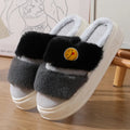 Pair of pink and green thermal cotton slippers with a plush upper and non-slip sole.